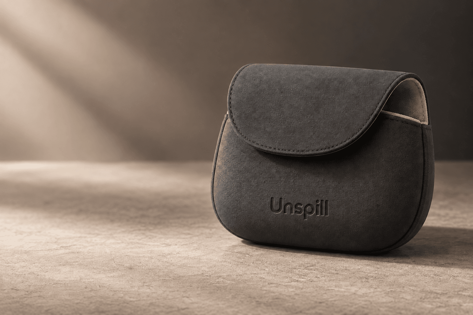 Charcoal Unspill carry pouch with a soft oat lining
