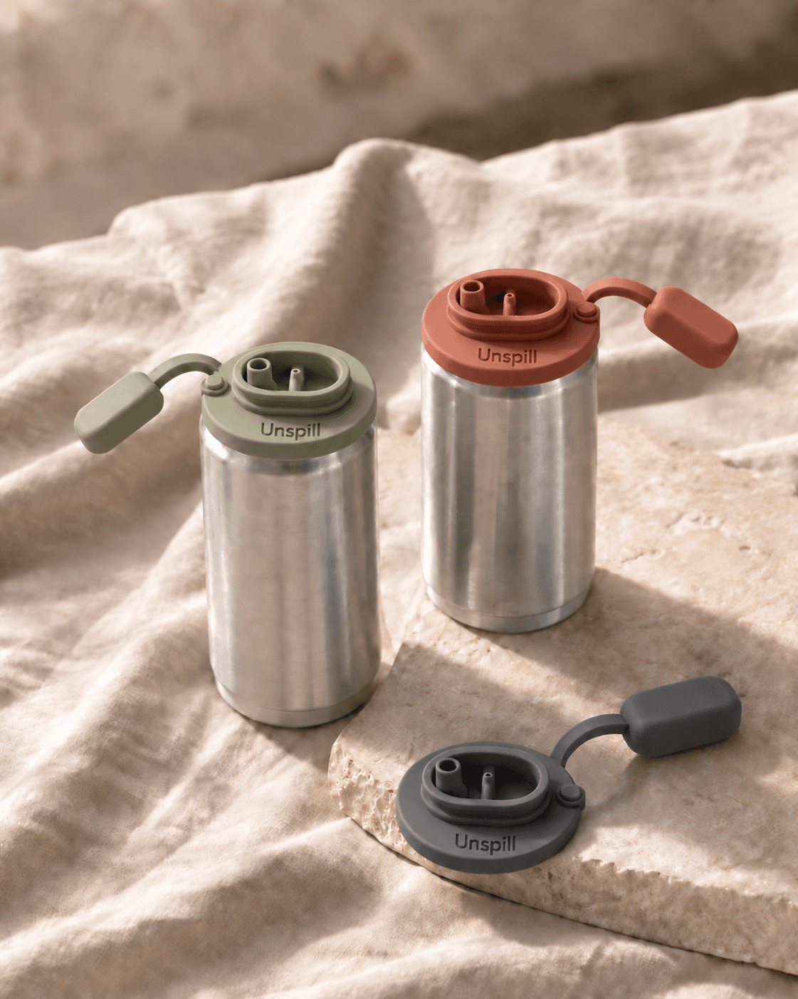 Sage and Terracotta Unspill can covers at a refined picnic